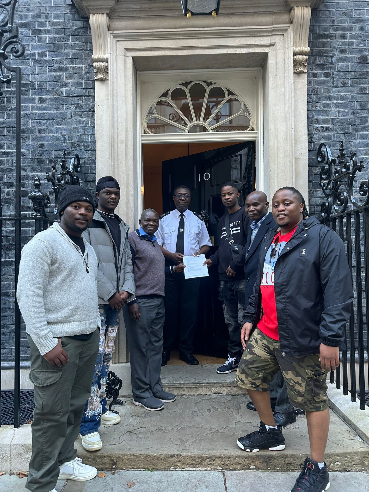 At the Door to 10 Downing Street